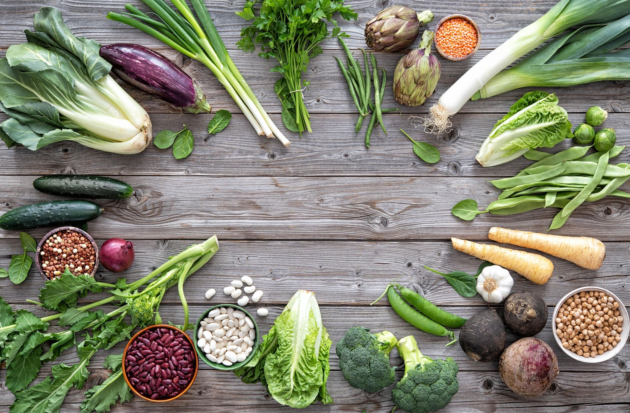Fresh vegetables on rustic wooden table for Daniel Fast recipes