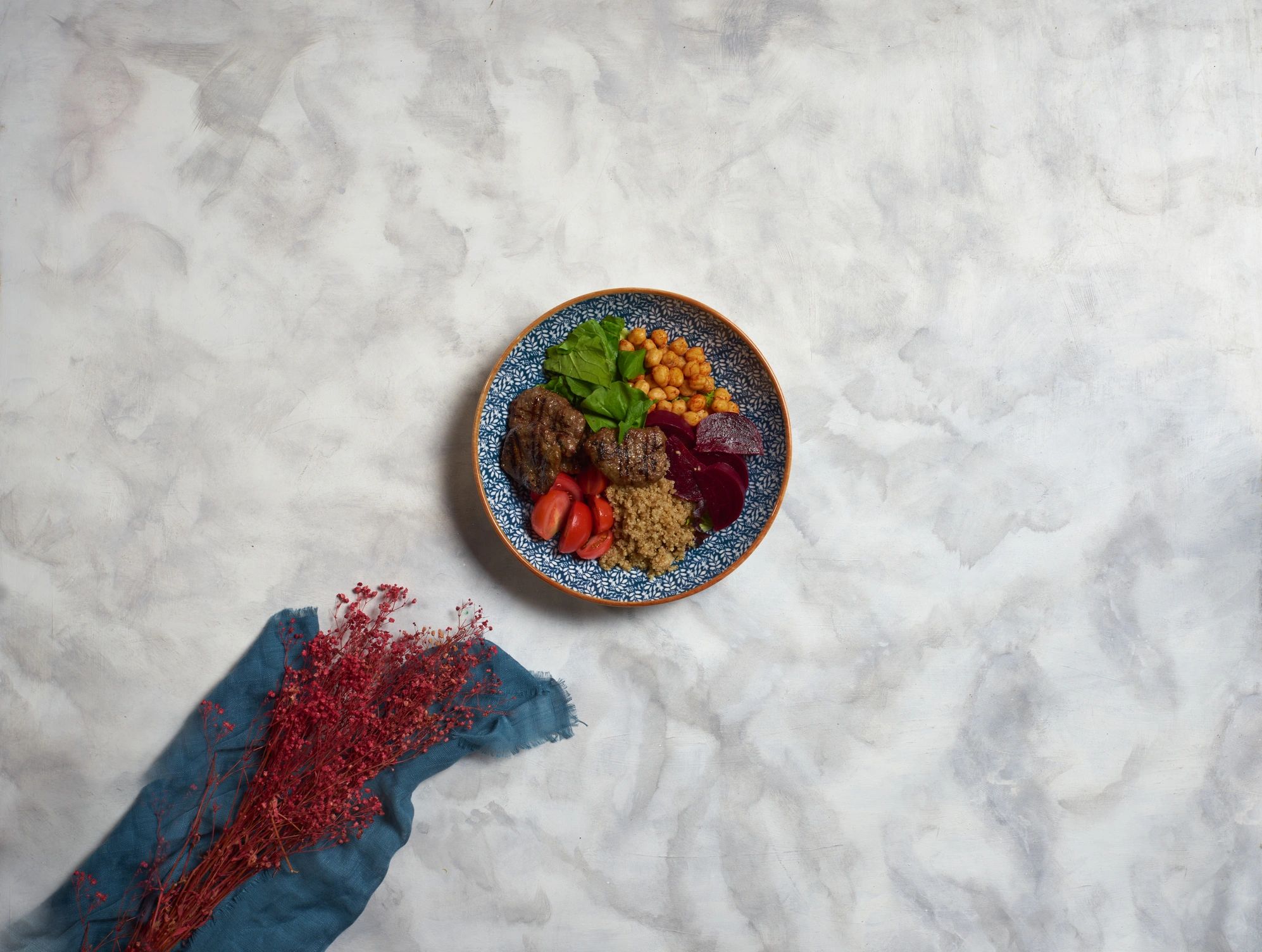 Rustic vegetable and grain bowl on a table