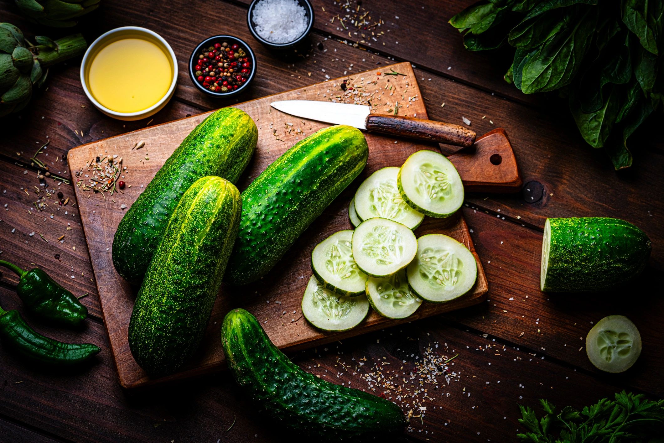 Fresh vegetables arranged on a rustic kitchen table