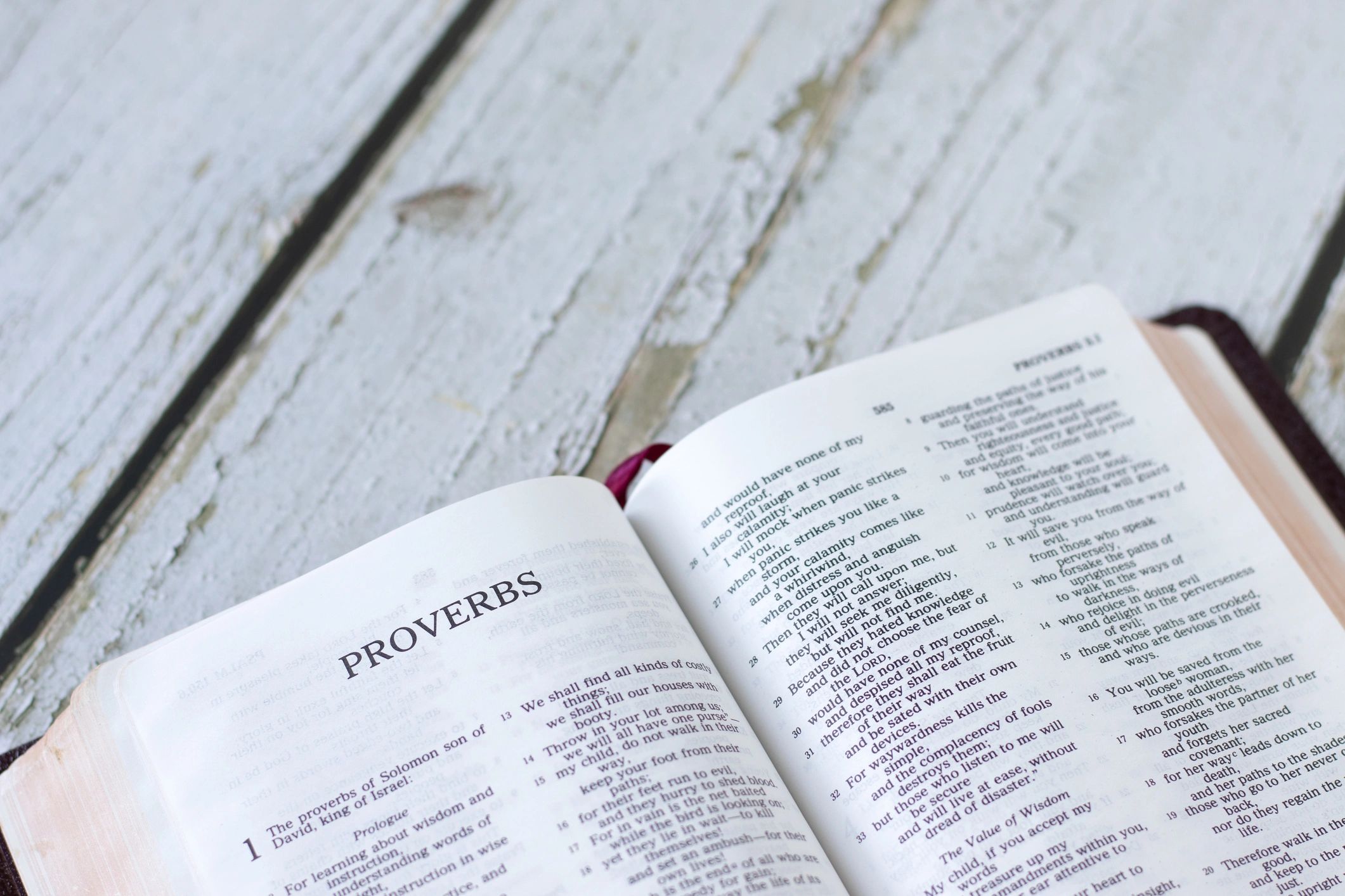 Open Bible on a wooden table for devotional reading
